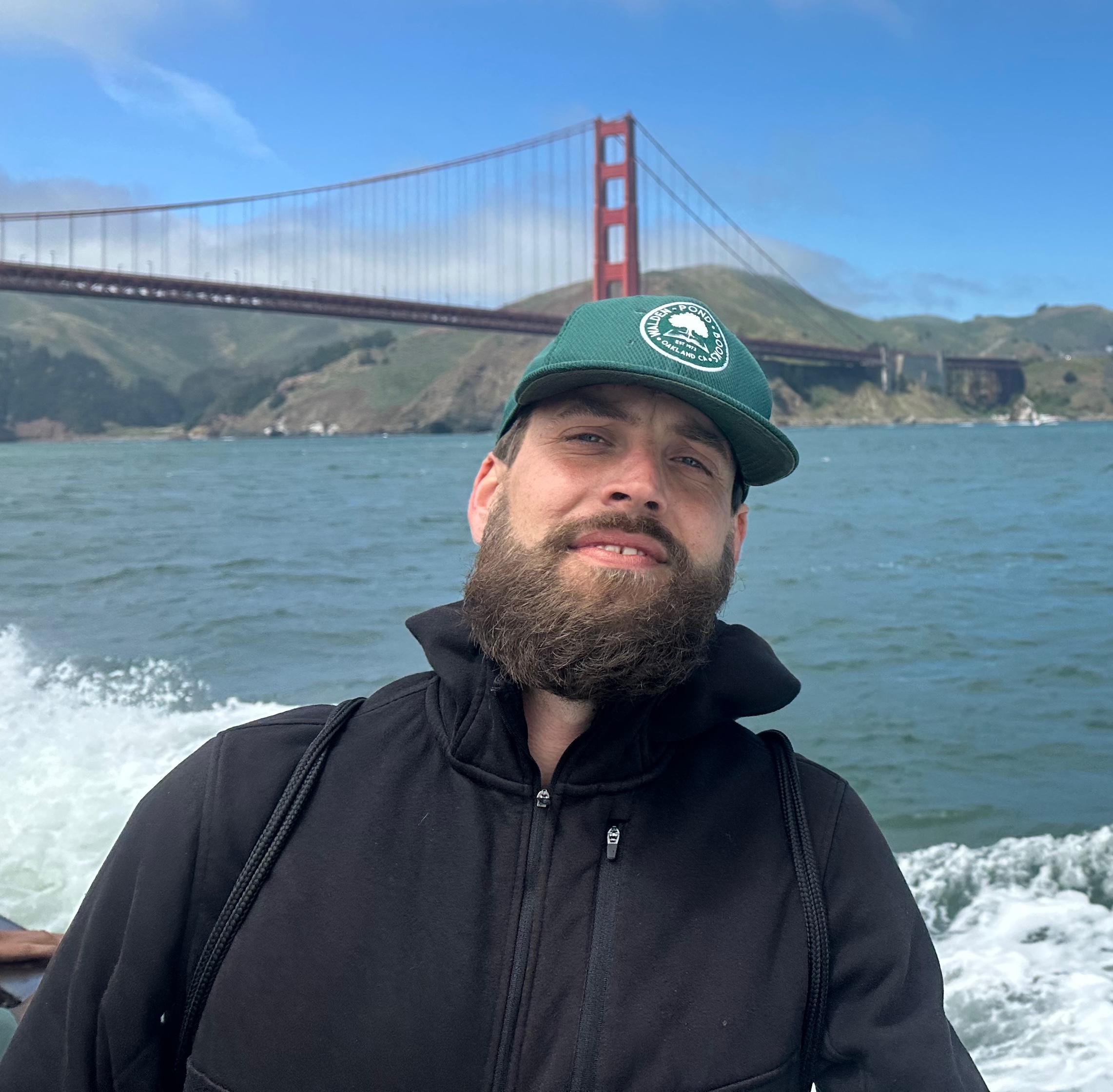 Neil Ricci smiling with the Golden Gate Bridge in the background
